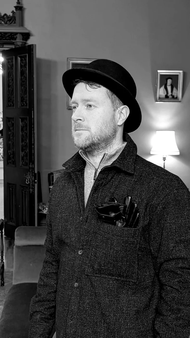 James in a bowler hat, in black and white