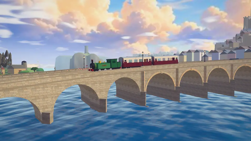 A green steam train crosses a long stone bridge over the sea.